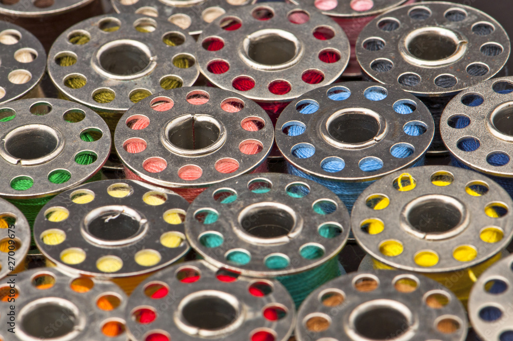 Colorful spools of yarn in a close-up Colorful spools of yarn in a close-up