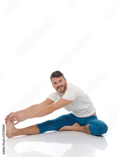 Handsome active man doing yoga fitness poses. isolated on white