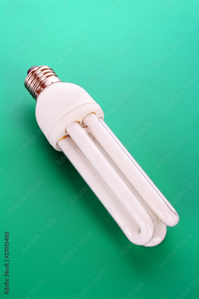 Energy saving light bulb on green Energy saving light bulb on green