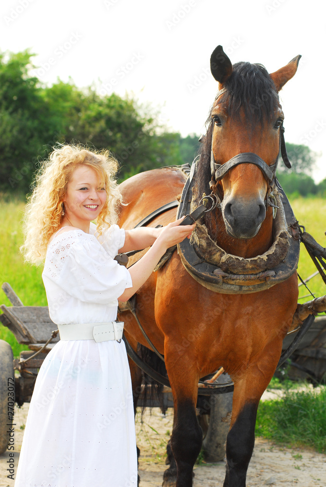 Obraz premium teenage girl with a horse