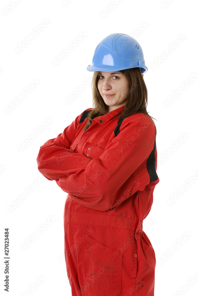 young female manual worker in coveral and helmet young female manual worker in coveral and helmet