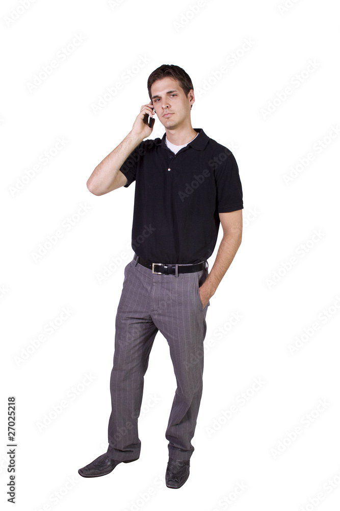 Young businessman conversing on cell phone Young businessman conversing on cell phone