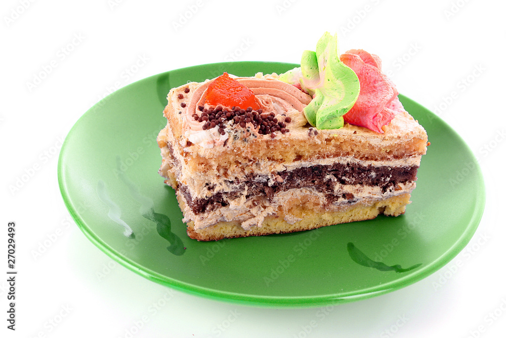 sweet cake in heart shape on green plate