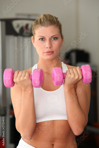 Closeup of woman working out in gym