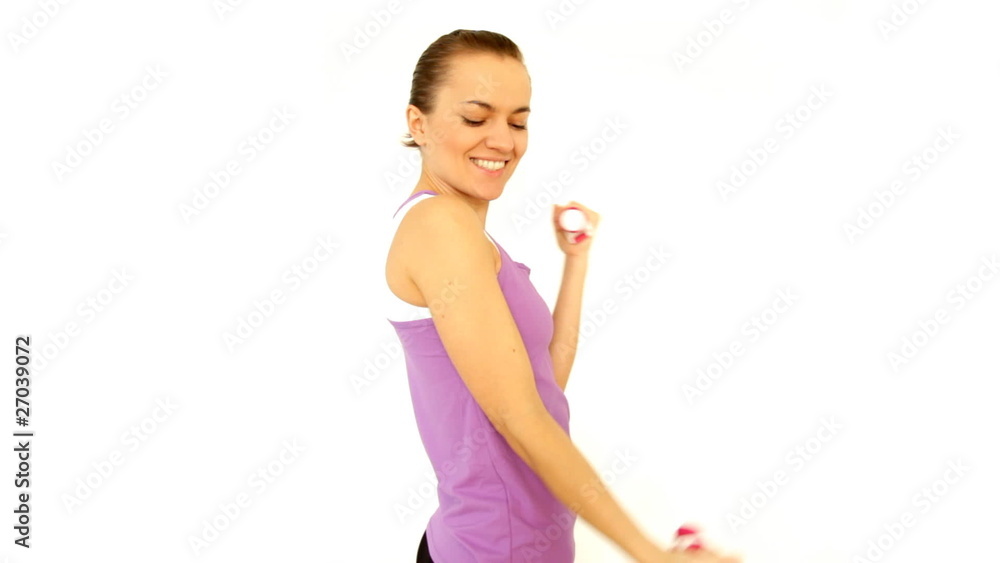 Beautiful young woman working out with dumbbells, isolated Beautiful young woman working out with dumbbells, isolated
