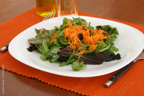 salad with bottles of oil and vinegar photo