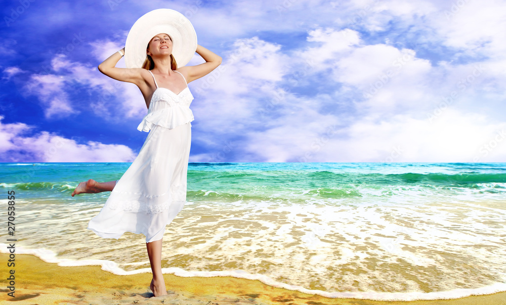 Young beautiful women in the white with pareo on the sunny tropi Young beautiful women in the white with pareo on the sunny tropi