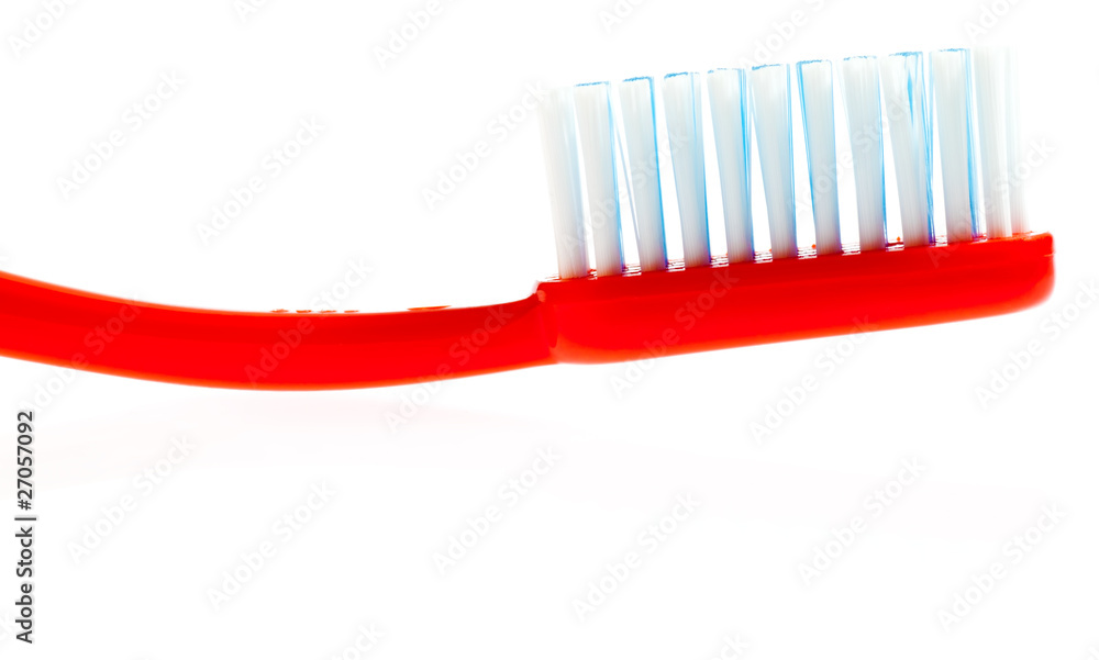 Red toothbrush isolated on white Red toothbrush isolated on white