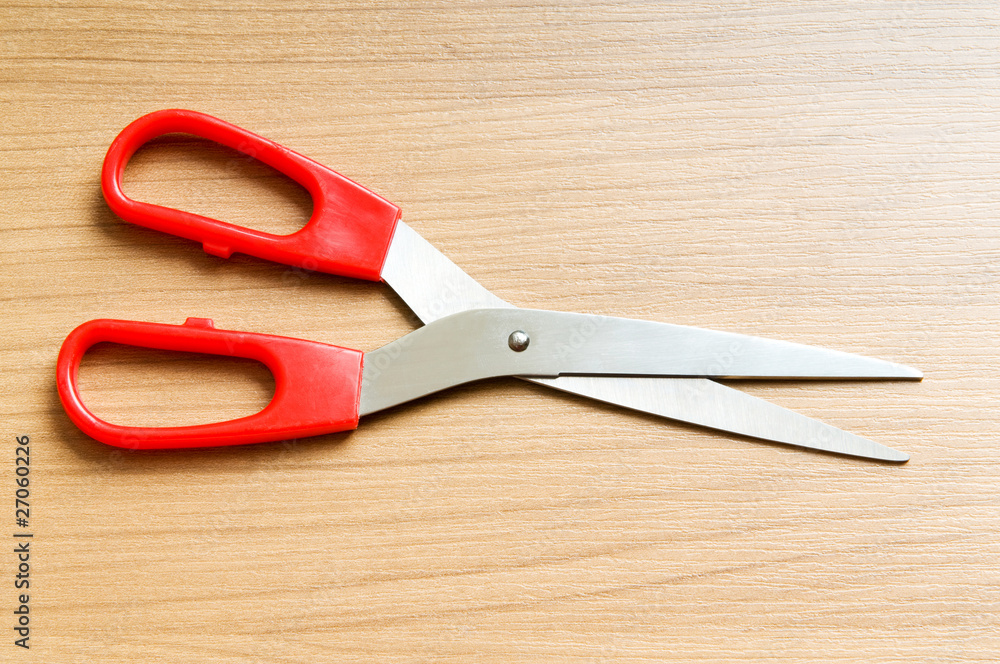 Various scissors on the wooden background Various scissors on the wooden background