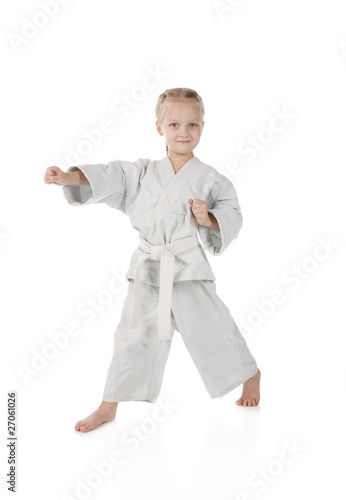 girl - karateka in kimono on a white background