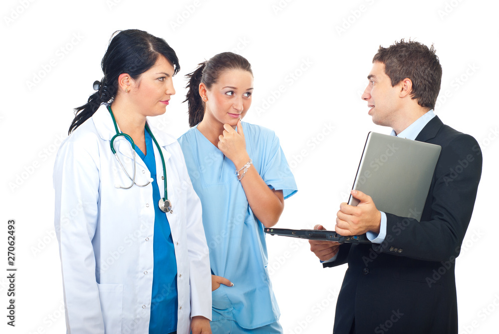 Man with laptop having conversation with doctors Man with laptop having conversation with doctors