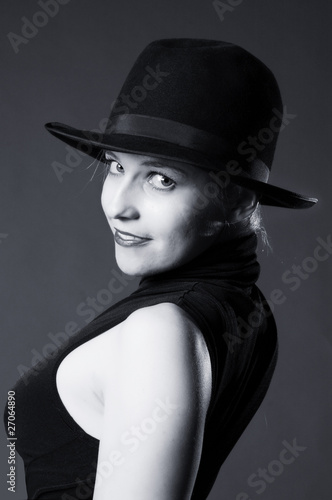 Sexy blonde woman with hat. Erotic art photo.