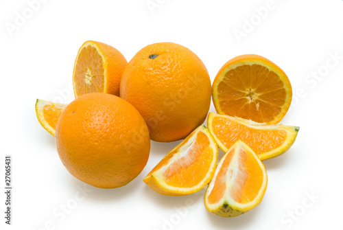 Slices of peeled orange on white background