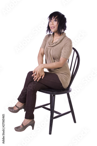 Beautiful Woman Posing on a Chair © Mehmet Dilsiz