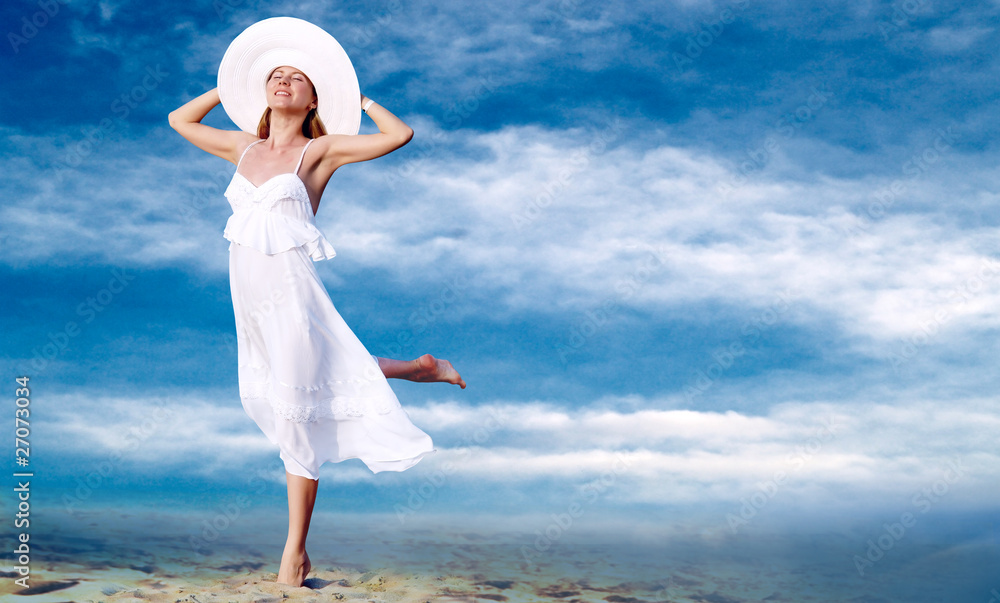 Young beautiful women in the white with pareo on the blue sky ba Young beautiful women in the white with pareo on the blue sky ba