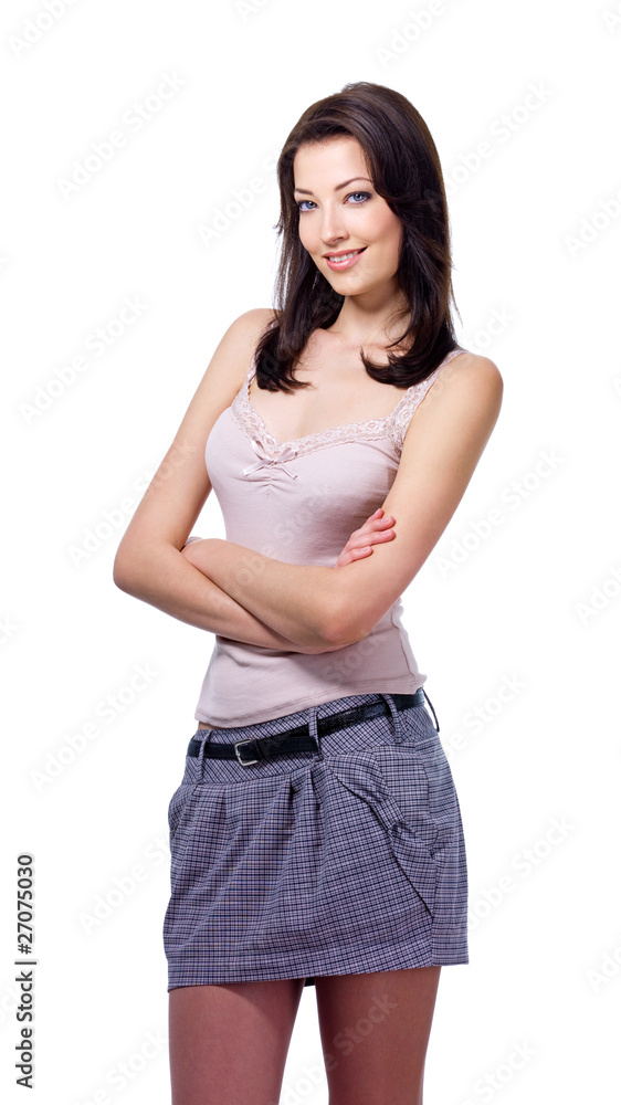 Beautiful young woman standing with crossed arms Beautiful young woman standing with crossed arms