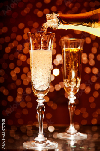 Champagne pouring into elegant glass
