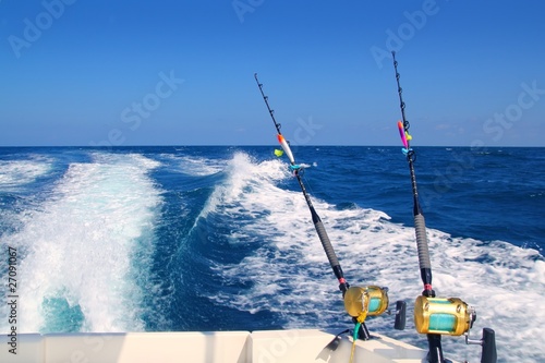 Slika na platnu Trolling fishing boat rod and golden saltwater reels