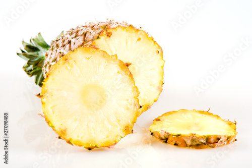 Cut pineapple isolated on white background