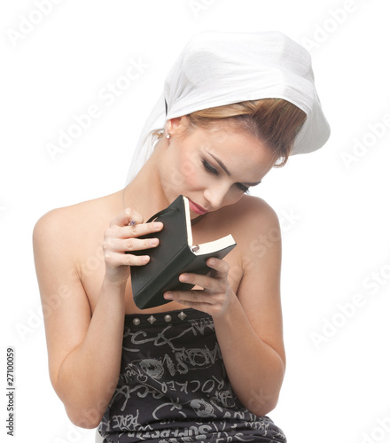 young woman looking in a notebook photo