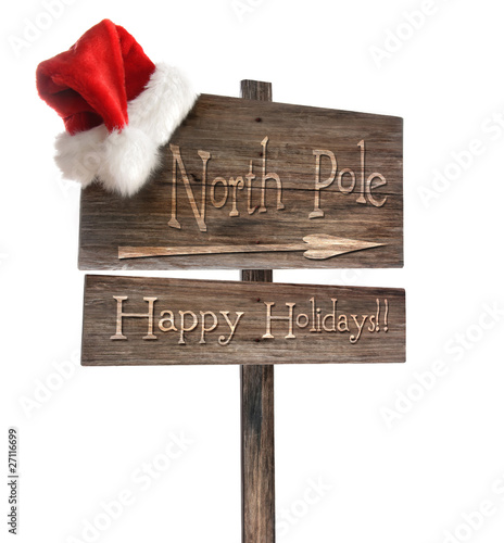 Weathered wooden sign with Santa hat on white