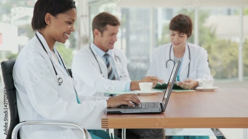 Wallpaper Mural Female Doctor Posing with her Laptop Torontodigital.ca