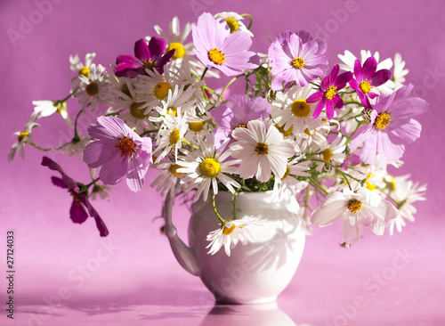 bouquet of daisies in a white vase
