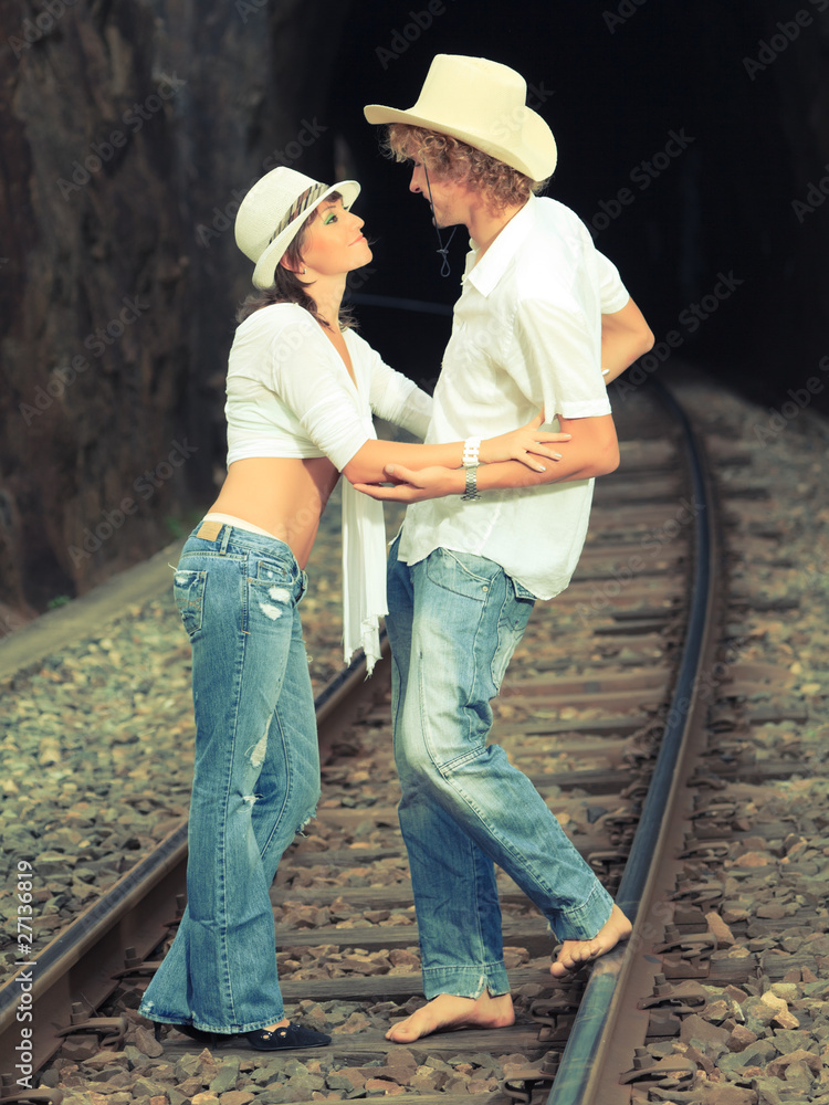 Couple on train tracks