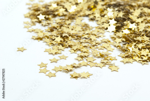 close up of confetti on white background
