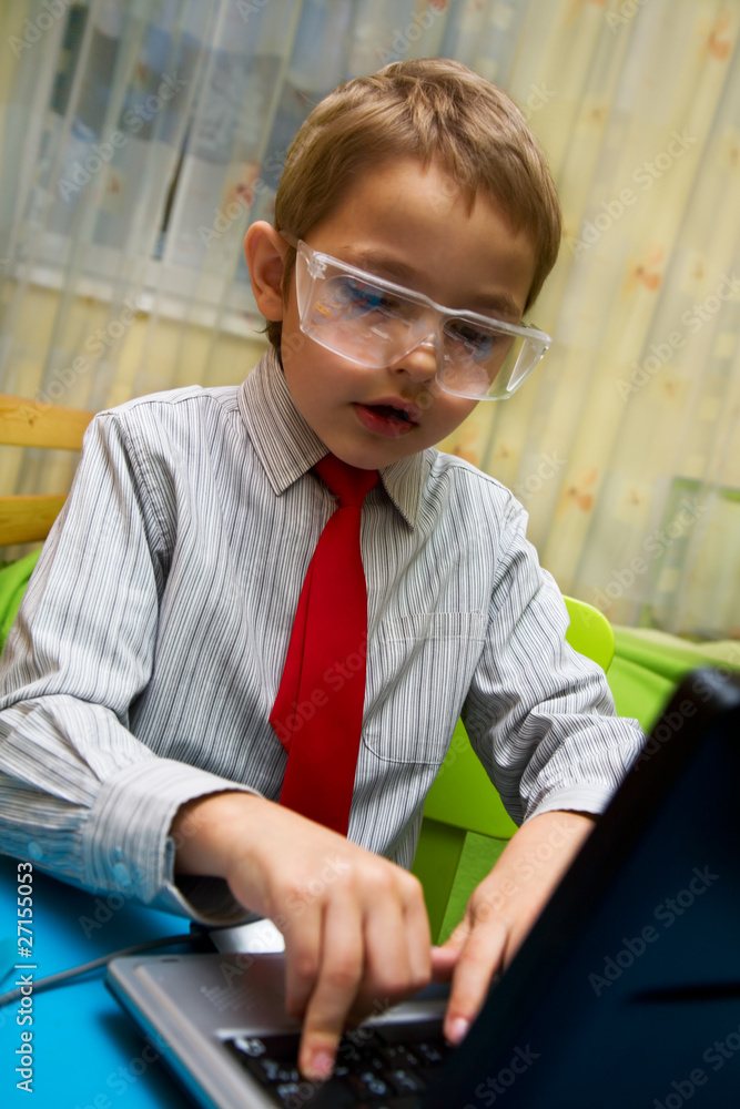 A boy plays in the scientist chemist