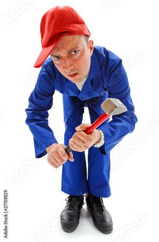 Obraz na plátne Awkward repairman with hammer