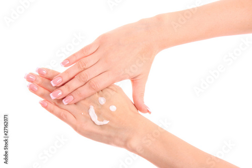 Closeup of beautiful female hands applying hand cream isolated o © Africa Studio