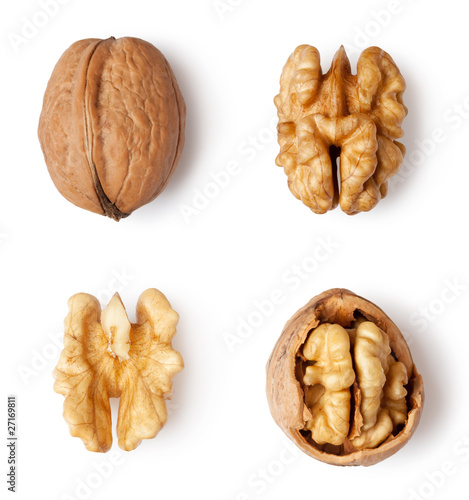 walnut and a cracked walnut isolated on the white background photo