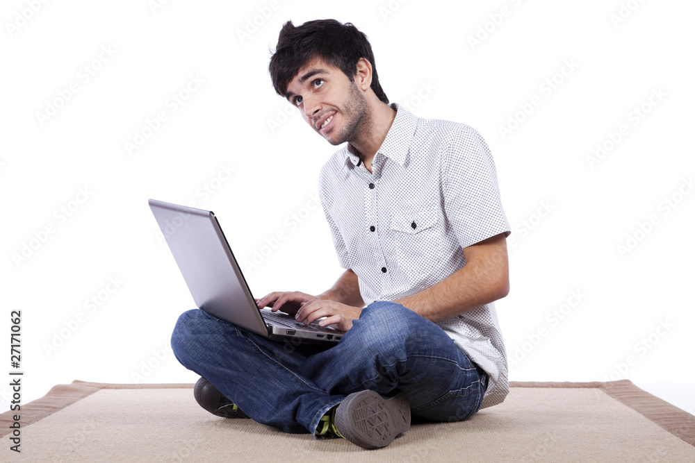 Happy young man surfing the internet
