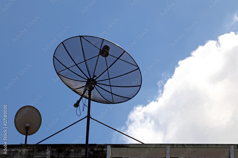 big and small satellite dish on the building
