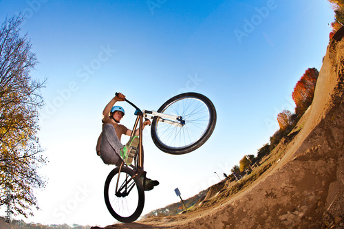 boy going airborne with his  bike