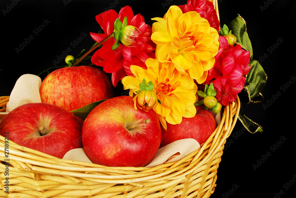 Autumn basket with apples and flowers Autumn basket with apples and flowers