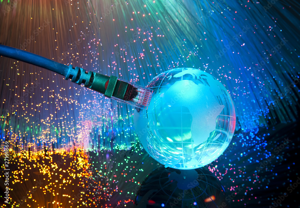 glass globe on a laptop keyboard glass globe on a laptop keyboard