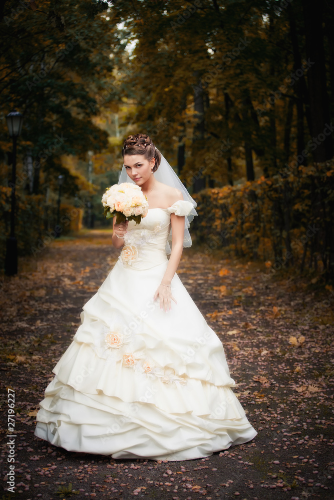 Portrait of bride on alley of moscow estate