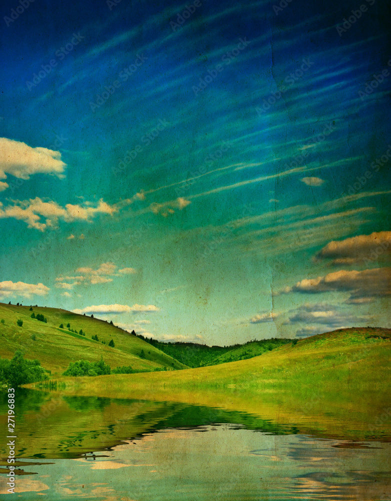 Fototapeta premium grunge photo of green field and blue sky