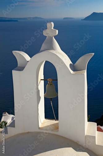 Bell tower of small church in Oia, Santorini, Greece.