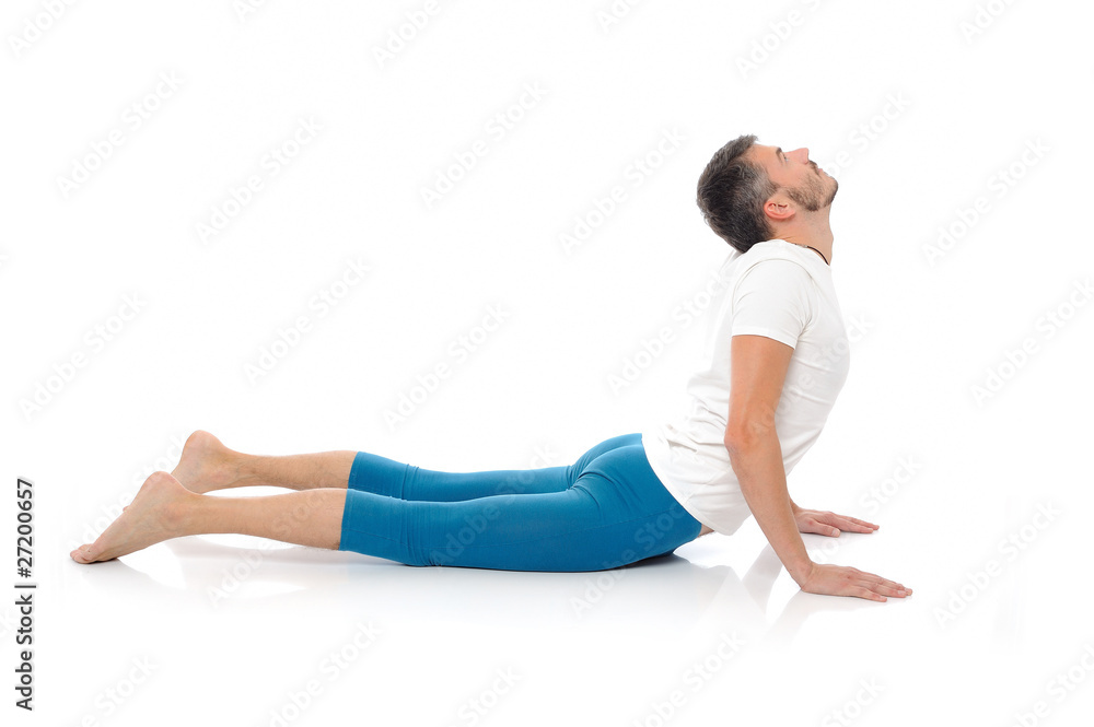 young man practising yoga postures combination cobra. isolated o young man practising yoga postures combination cobra. isolated o