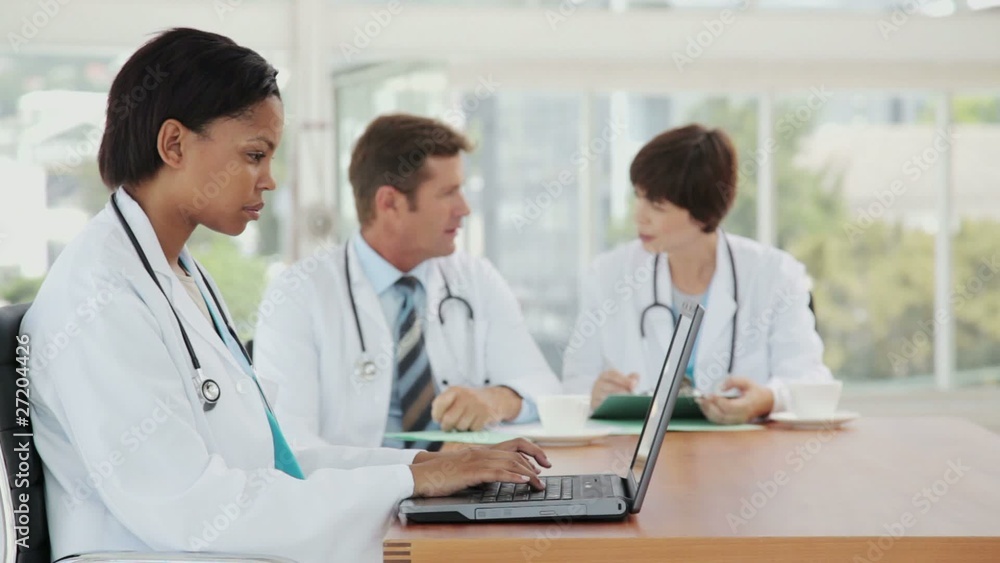 Female Doctor Multitasking on a Break Female Doctor Multitasking on a Break
