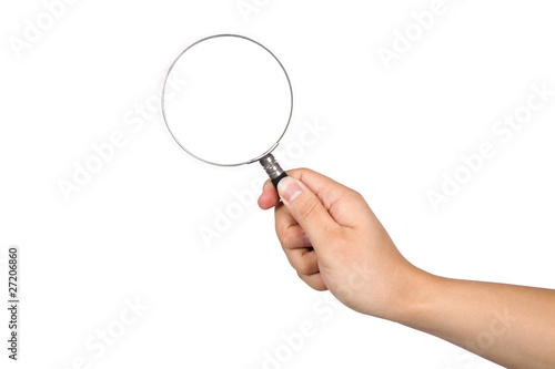 Hand-held magnifying glass in white background