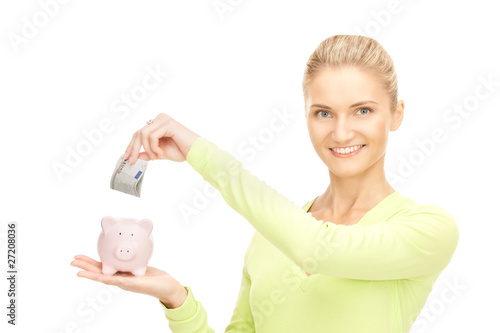 woman with piggy bank and money