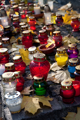 Colorful candles on cemetery
