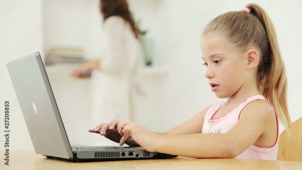 Little Girl Using a Laptop Little Girl Using a Laptop