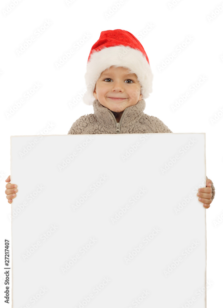 Little boy in Christmas hat with an empty banner Little boy in Christmas hat with an empty banner