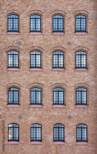 Factory windows in the wall of an old buildng in Venice