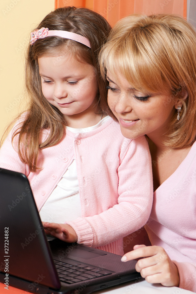 picture of happy mother and child with laptop computer picture of happy mother and child with laptop computer